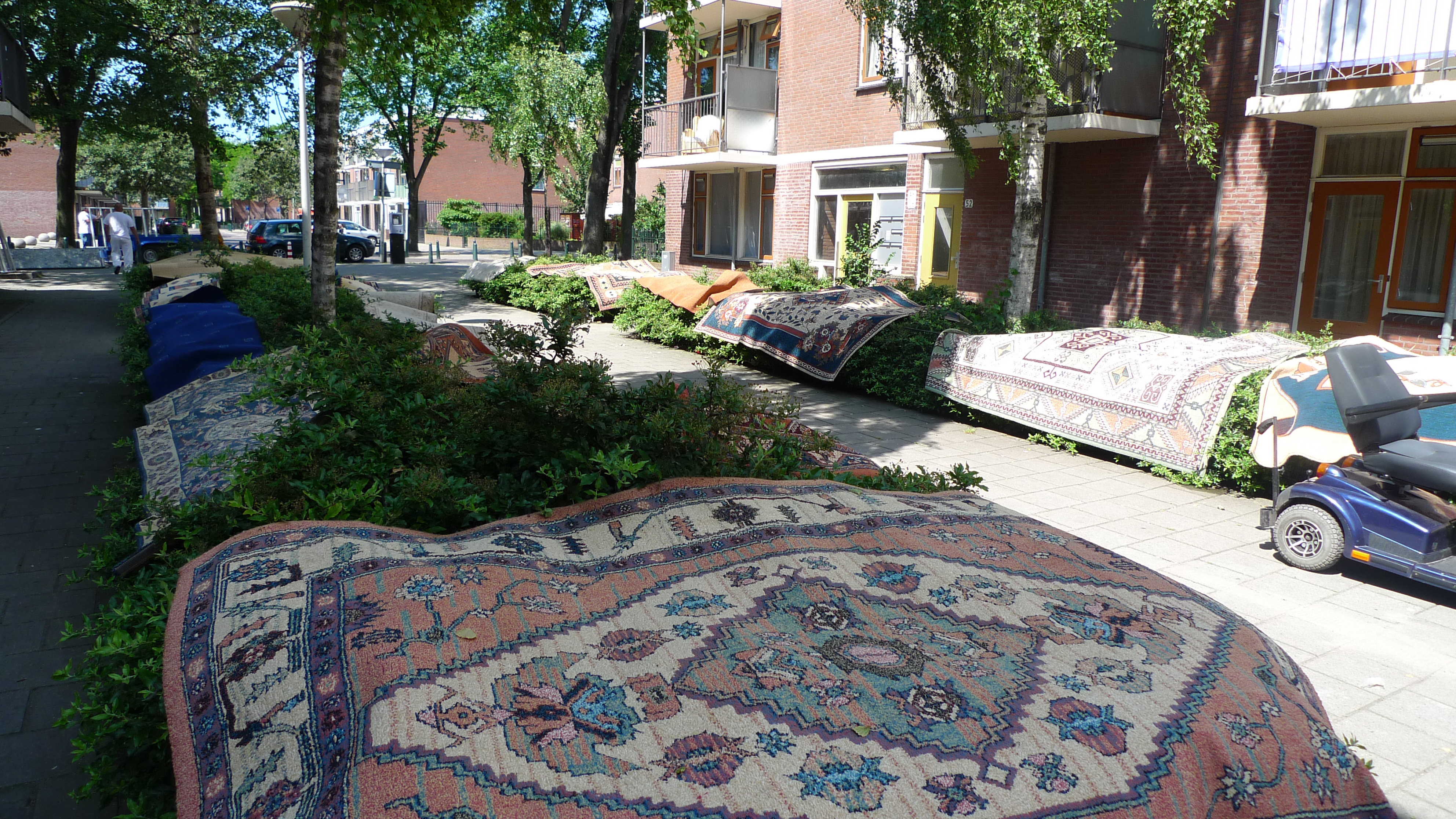 Public space in full use on communal carpet cleaning days in the Hague's Schilderswijk