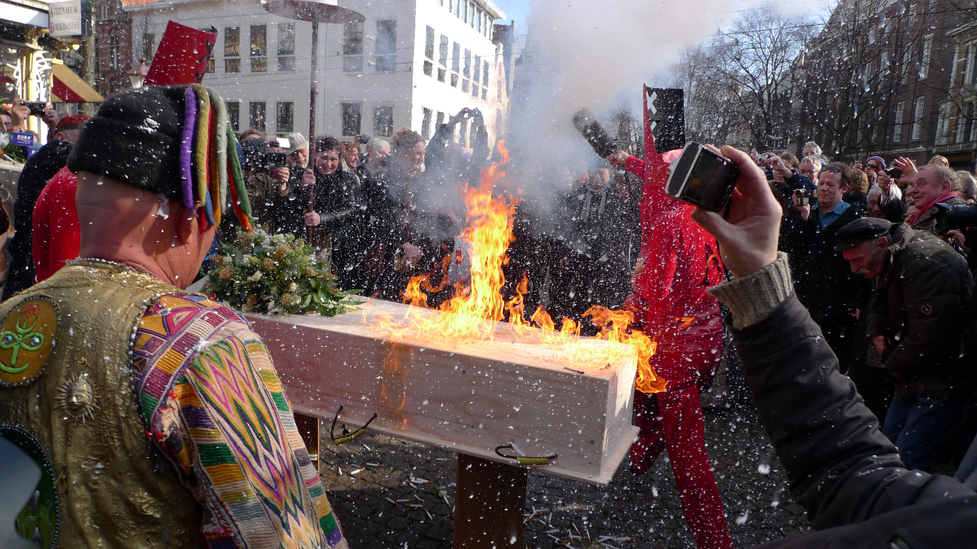 Begin with flames, explosions, fire extinguishers, and masked men in red leather aprons.