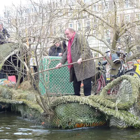 Those not on handmade rafts and boats, walk the entire distance and cheer those water-bound on at every single bridge.