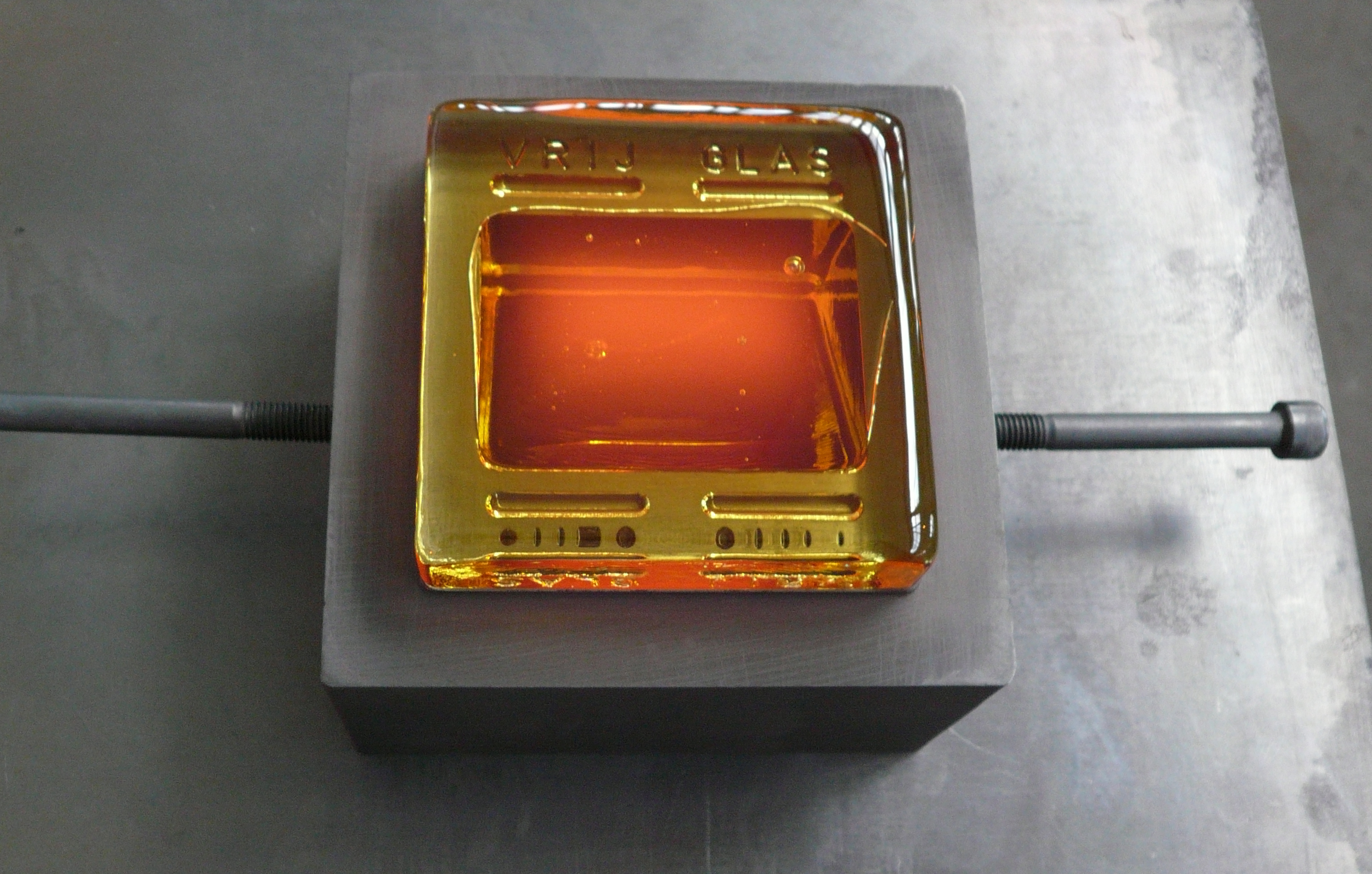 Hot glass poured in cast iron moulds. In production at Vrij Glas in Zaandam, NL.