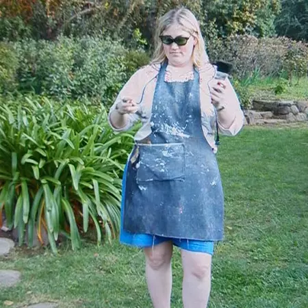 In archetypal polyester shorts, pluche slippers, denim apron, Ukranian folk blouse, and Malcolm X sunglasses, Bec actually looks like Grams. This outfit was more or less the 'wedding dress' of the fashion show. I think Bec is tuning Gram's soldering iron.
